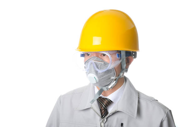 istock Young Japanese man wearing work clothes wearing face masks and helmets 654294776