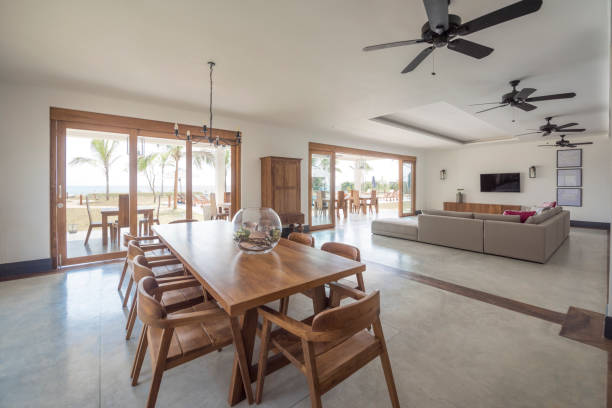 istock Contemporary open plan dining area with wooden table and chairs 654302452