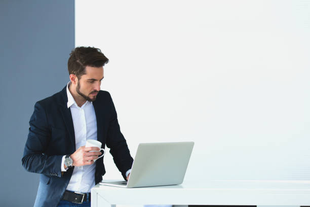 istock Thoughtful young businessman using laptop looking for new ideas. 654302624