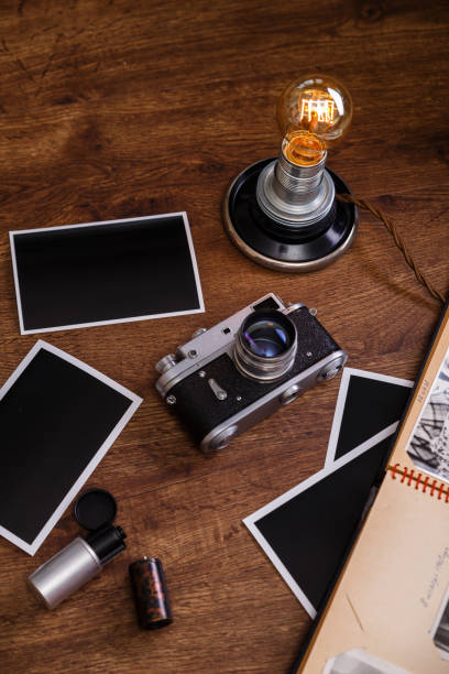 istock Vintage photo camera. Blank photo frames. 654302960