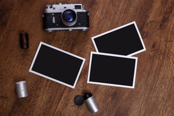 istock Vintage photo camera. Blank photo frames. 654303150