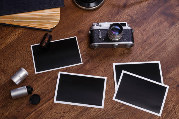 istock Vintage photo camera. Blank photo frames. 654303324