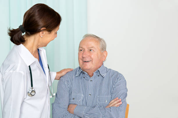 istock Doctor with senior patient 654303504