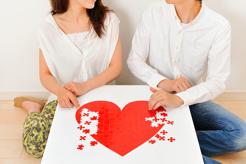 Red heart puzzle making Japanese men and women