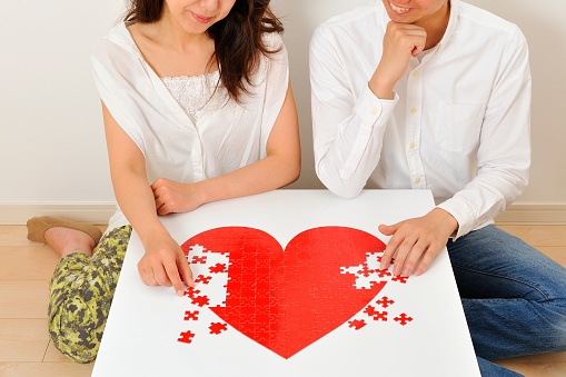 Red heart puzzle making Japanese men and women