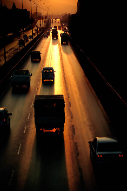 istock highway and cars during sunset 654307378