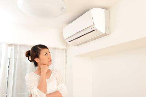 istock Japanese woman gestures with air conditioning 654313158
