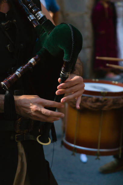 istock street musician playing 654314884