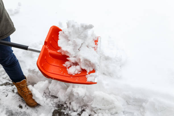 istock Man with shovel cleaning winter snow. 654319020