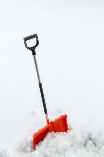 istock Winter shoveling. Removing snow after blizzard. 654319138