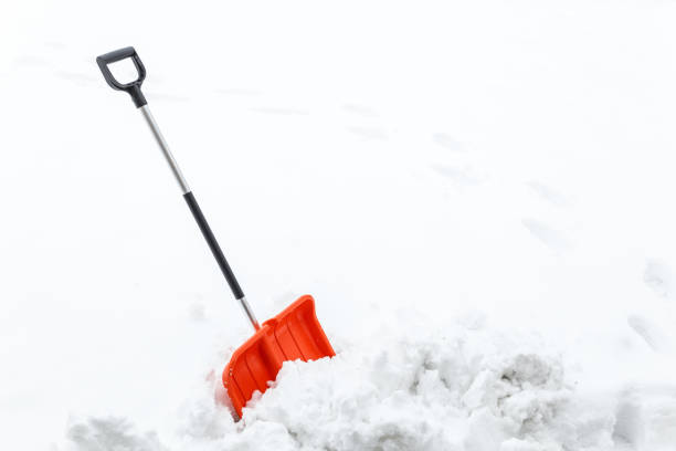 istock Winter shoveling. Removing snow after blizzard. 654319200