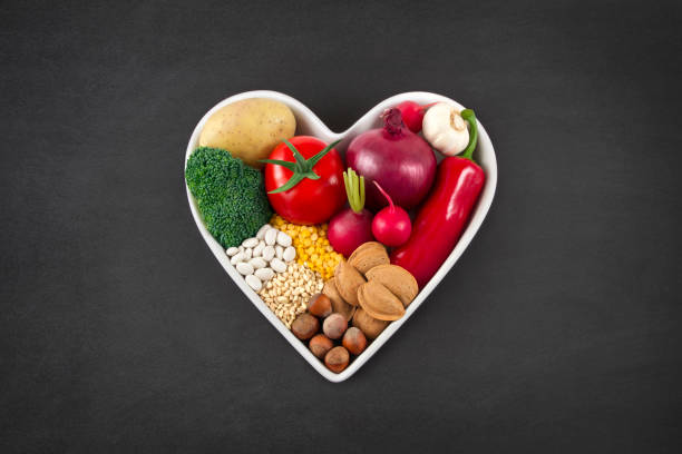 istock Vegetables in Heart Shaped Bowl on Blackboard 654328002
