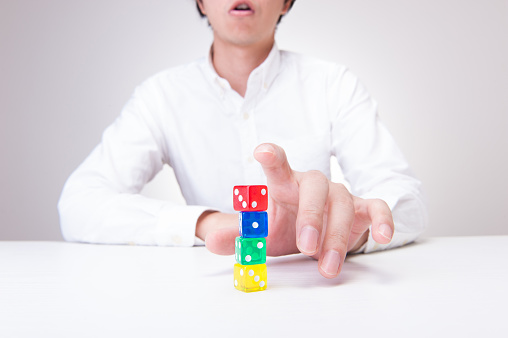 Japanese men with colorful dice hand