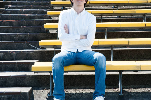 Japanese men are sitting in the audience