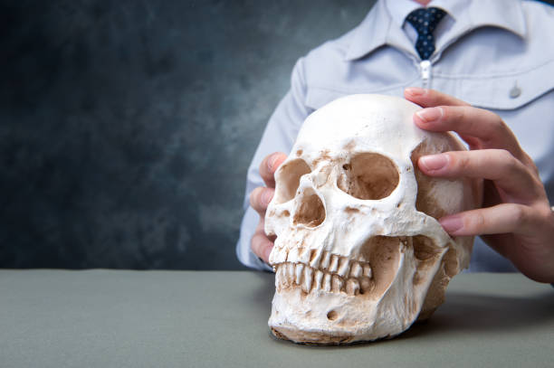 istock Japanese men wearing overalls with a human skull hands 654332386