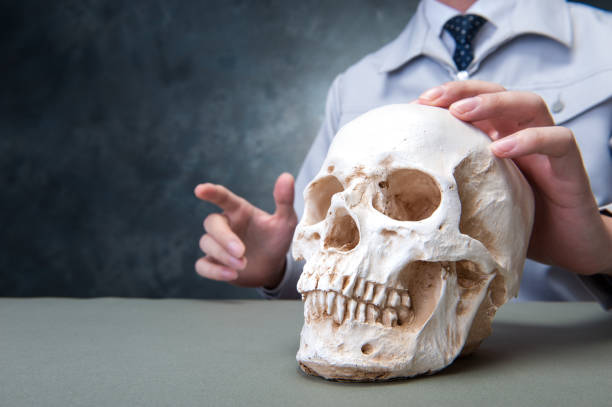 istock Japanese men wearing overalls with a human skull hands 654332394