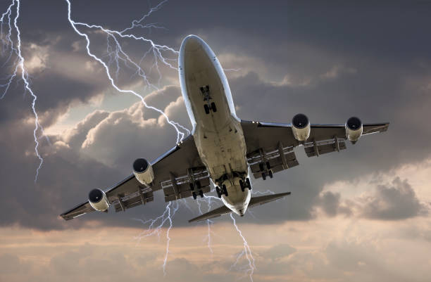 istock jumbo jet airplane landing in storm 654332478