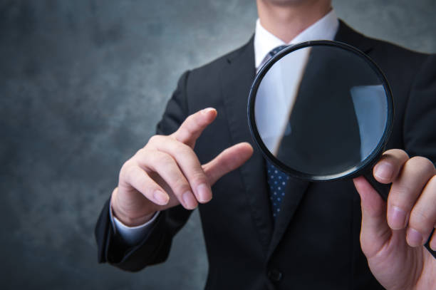 istock Japanese with a large magnifying glass 654334702