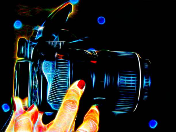istock Image of female hands with a camera in neon light 654344850