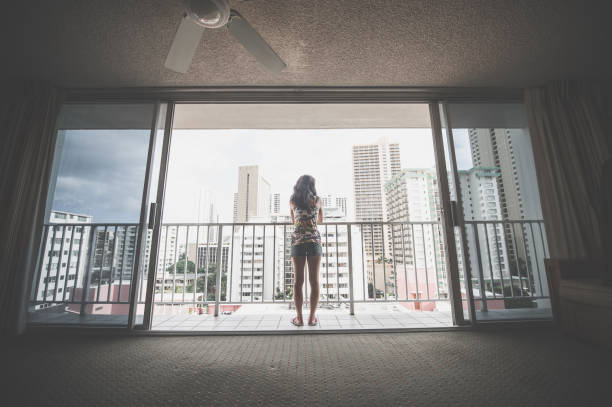 Woman standing on a balcony