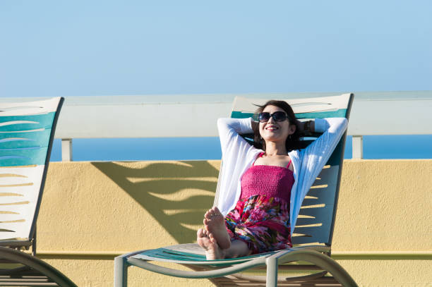 istock Woman relaxing on a recliner 654352958
