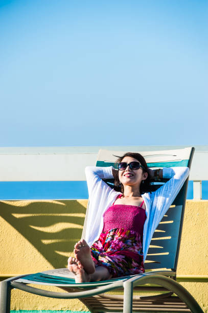 istock Woman relaxing on a recliner 654352964