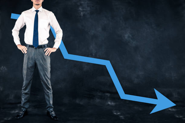 istock Businessman standing with arrow 654352998