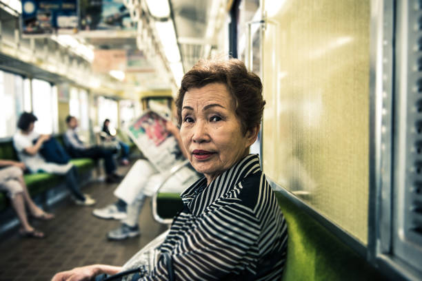 istock Elderly woman on a train 654353486
