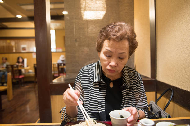 istock Woman sitting in a restaurant 654353672