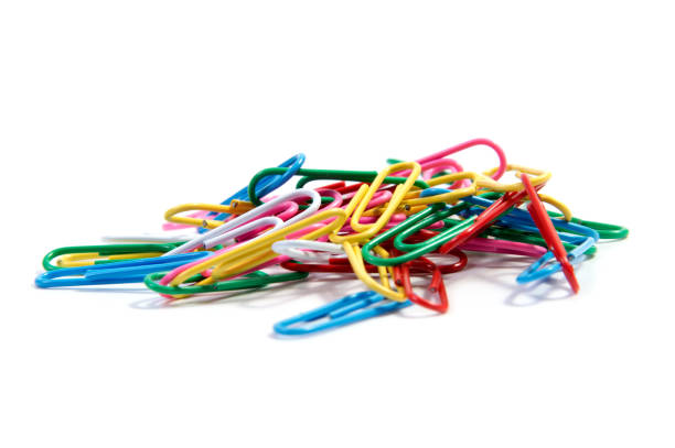 istock Bunch of colorful paper clips on white backgrpund 654354502