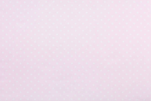 istock Pastel pink polka dot fabric background 654357966