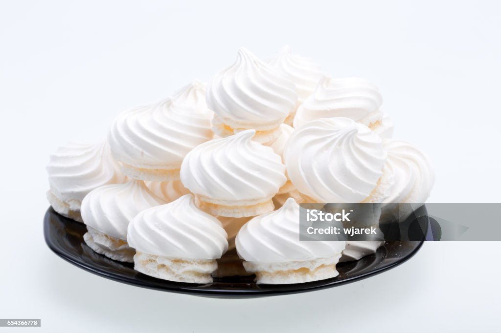 French vanilla meringue cookies on white background Meringue Stock Photo