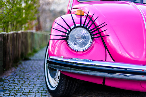 Izmir, Turkey, March 16, 2016: Old fashioned car parked next to the garden in Izmir. The Volkswagen Type 1, widely known as the Volkswagen Beetle, was an economy car produced by the German auto maker Volkswagen (VW) from 1938 until 2003