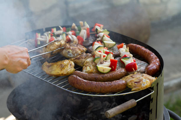 istock barbecue with delicious grilled meat and vegetables on grill 654366914