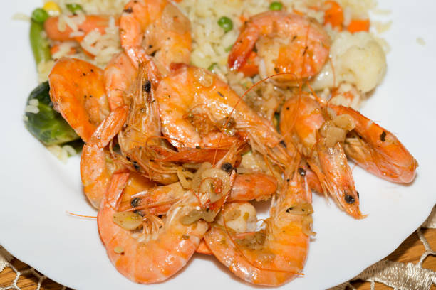 istock fresh gulf shrimps with garlic fried in olive oil 654366984