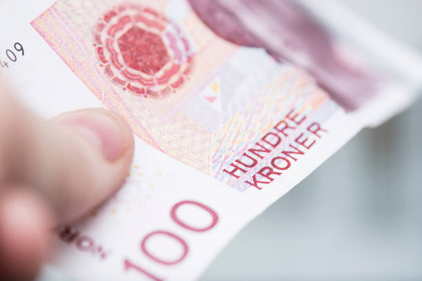 istock 100 (hundred) Norwegian kroner bill macro detail close up. 654373254
