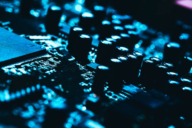 istock computer motherboard in blue dark background close-up 654373438