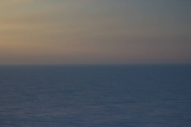 istock Endless ice desert at sunset. Minimalism, background. Sunset in the winter. 654375782