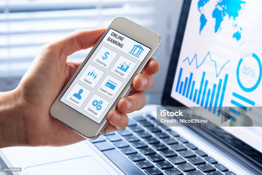 Online banking on smartphone with businessman showing screen Online banking app on a mobile phone screen with a business person using finance and bank on internet Electronic Banking Stock Photo