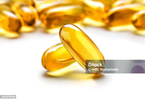 Two Capsules Omega 3 Isolated On White Background Stock Photo - Download Image Now - Omega-3, Capsule - Medicine, Pill