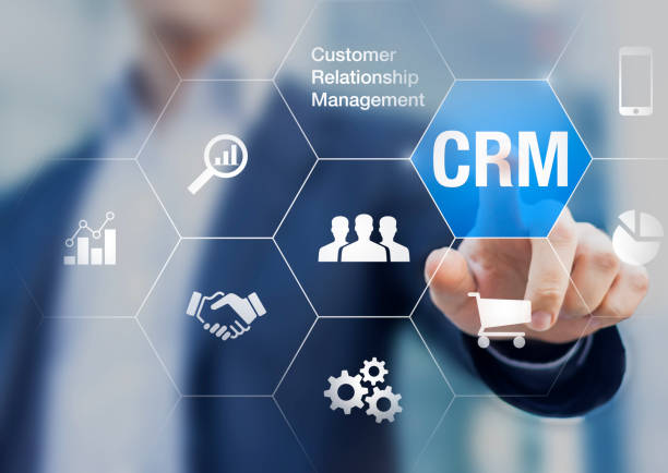 Customer relationship management concept with businessman touching button in background