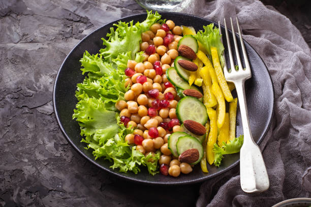 istock Salad with cucumber, pepper, pomegranate chick-pea 654382680