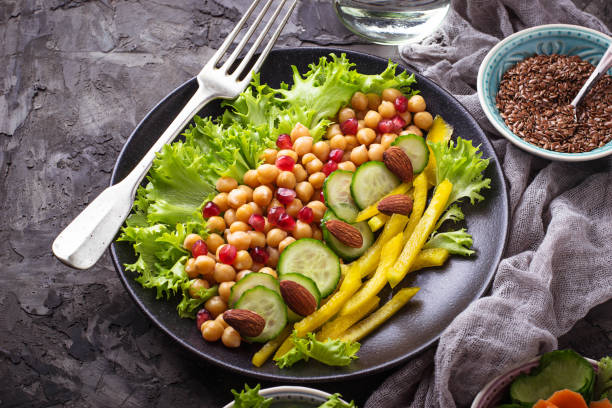 istock Salad with cucumber, pepper, pomegranate chick-pea 654382686