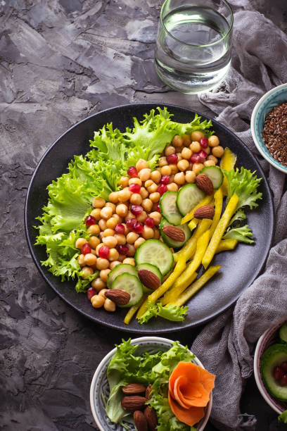 istock Salad with cucumber, pepper, pomegranate chick-pea 654382696
