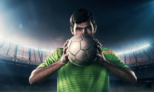 istock soccer player with a ball 654385494