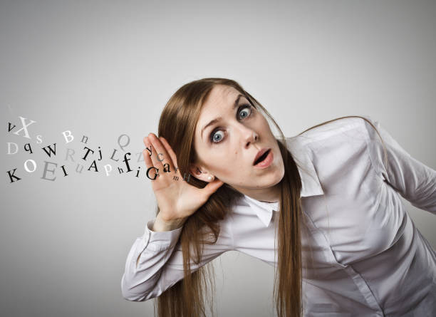 istock Curious girl in white is eager to know all the gossip 654385880