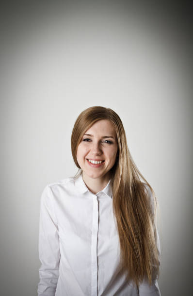 istock Happy woman in white 654385910