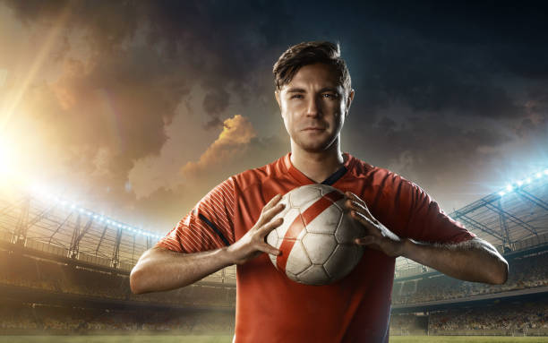 istock soccer player in red sports uniform 654385938