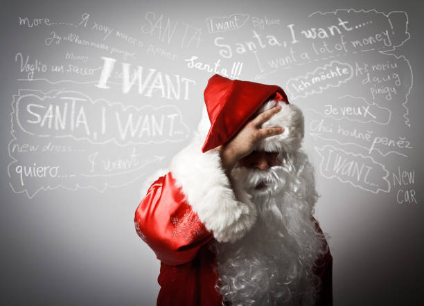 istock Frustrated Santa Claus and many wishes. 654385990