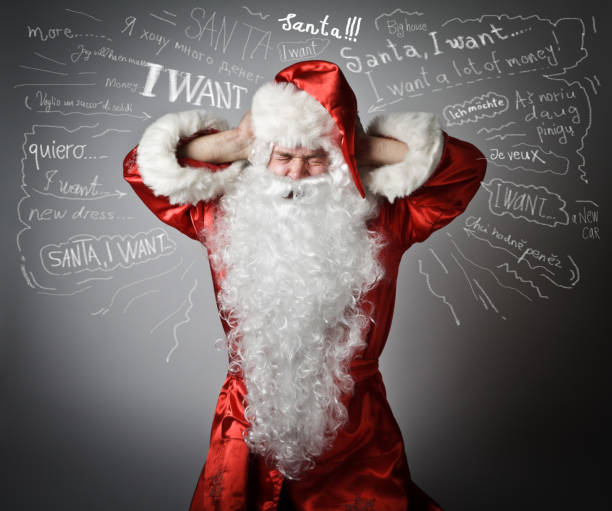 istock Santa Claus suffering from headache and many wishes 654385992
